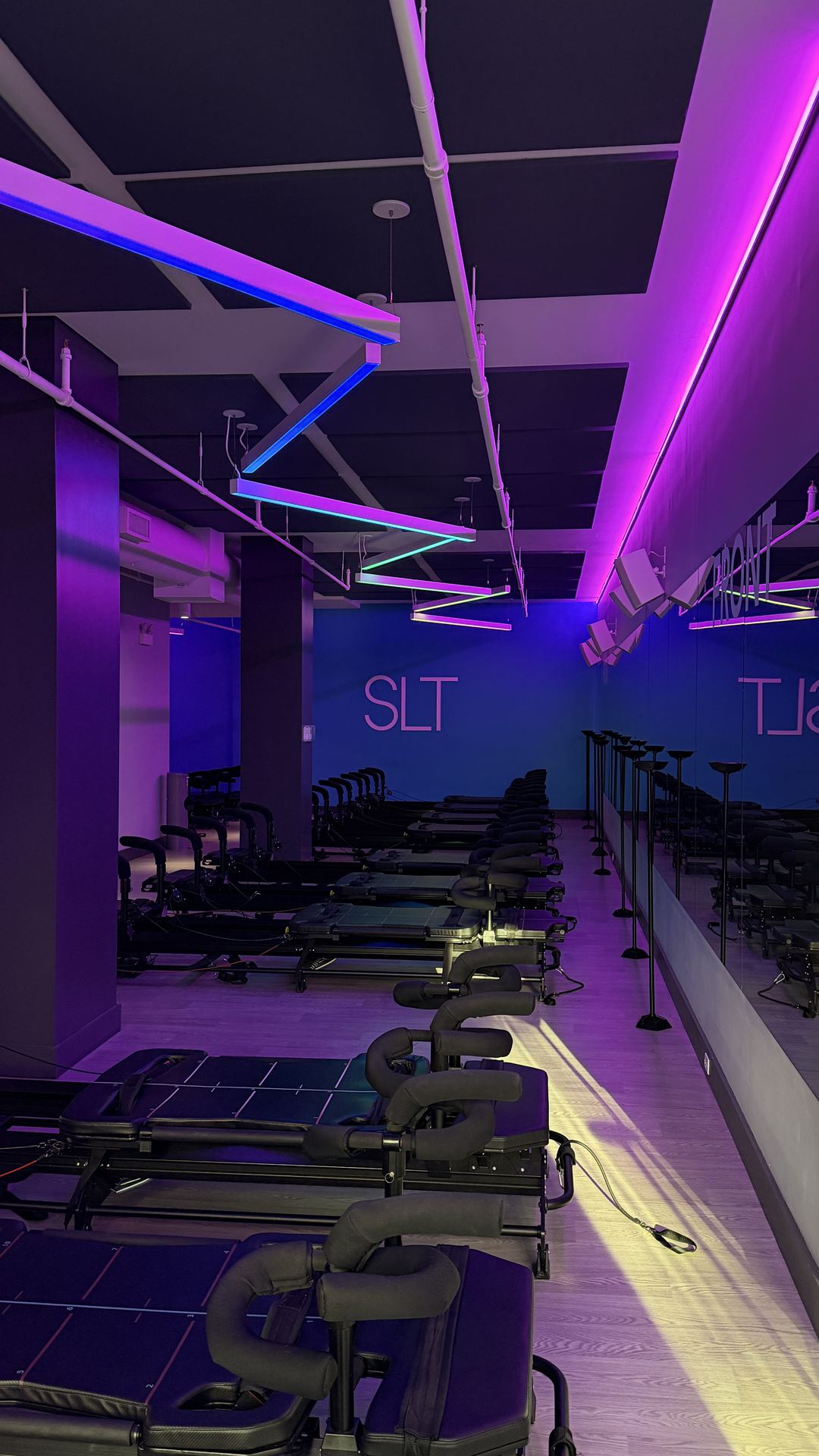 The SLT NoHo studio, empty, lit purple